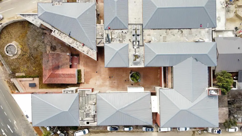 Top-down aerial of the Bendehuis roofs and courtyards