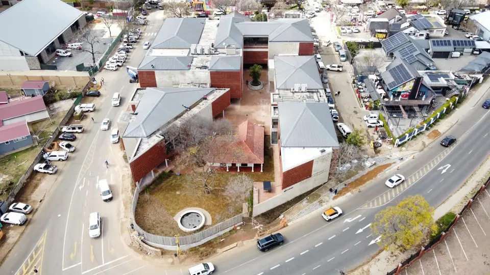 Aerial view across the site from the street