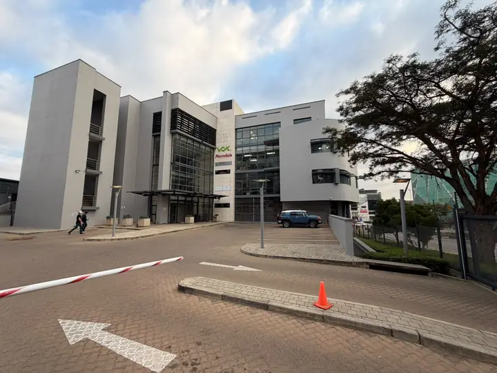 Entrance road into Corobay Corner, office blocks behind