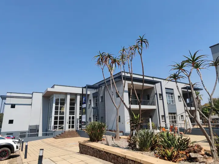 Entrance block with aloes and palms at Corporate Park 66