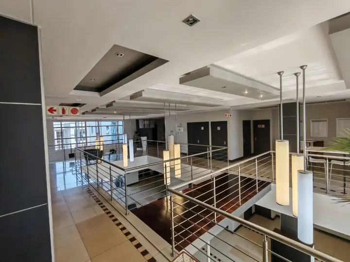 Double-volume atrium with steel balustrades at Corporate Park 66